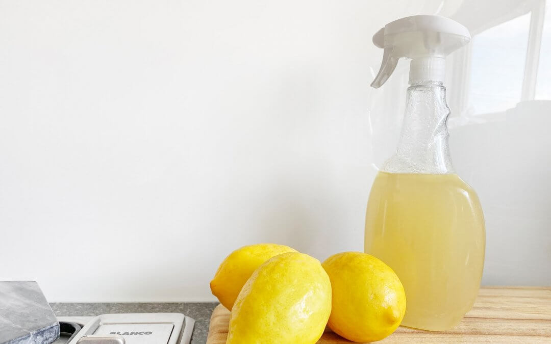 Lemons used to make cleaning solution in a spray bottle